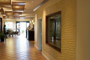Inviting Entrance using Celing Decor and Carved Wall Panels